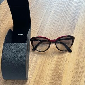 Prada Women's Sunglasses in Red and Brown